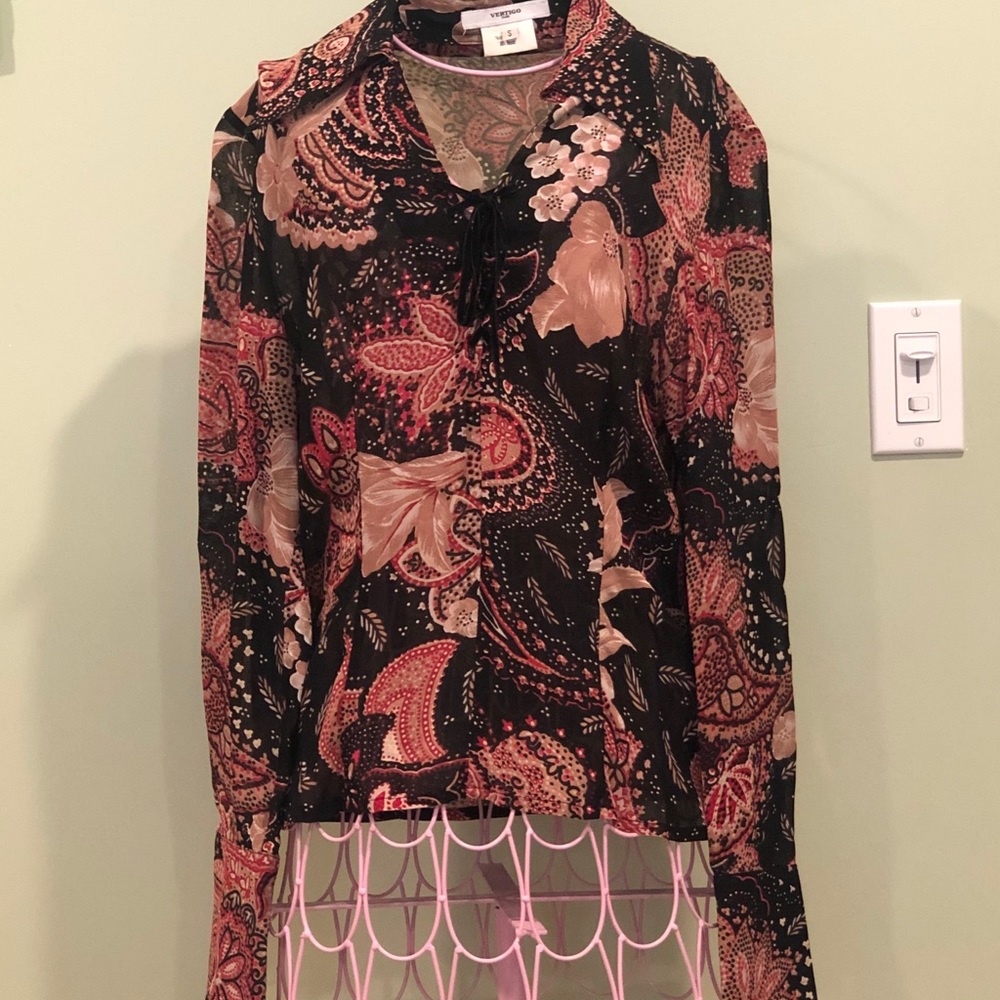 Black, red and beige vertigo blouse.